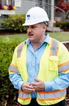 Photo of Gil Rivas in hard hat and safety vest